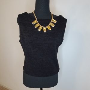 Dark grayish black crop top with leather cutout